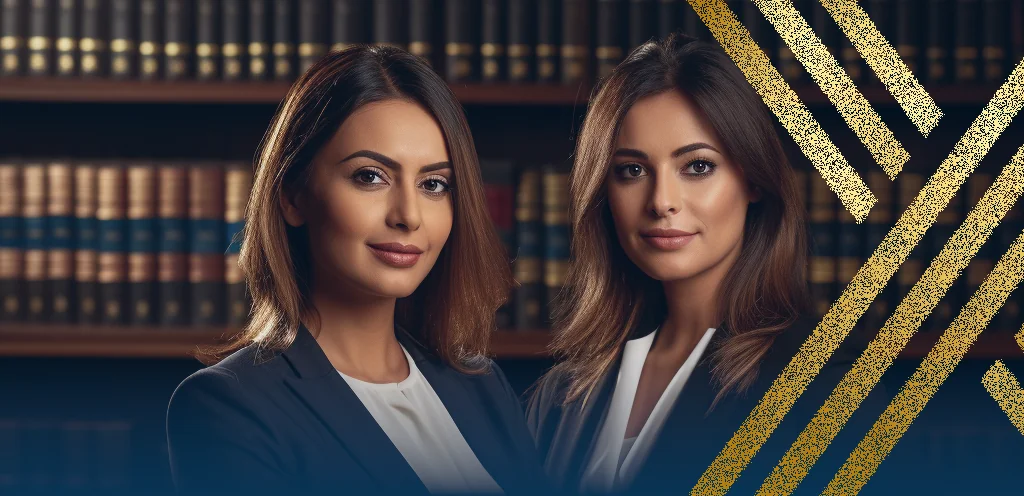 A photo of two women working as solicitors at Axis Solicitors Limited, the photo is meant to illustrate how they are explaining self-sponsorship for a skilled worker visa in the UK to the visitor.