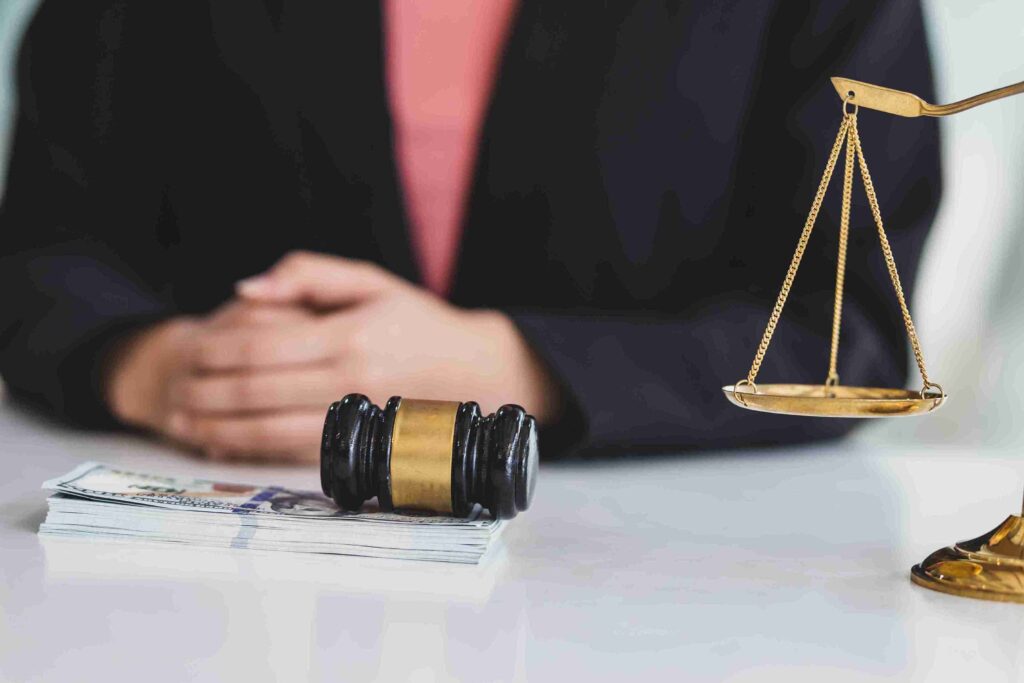 A photo of a solicitor explaining the expanded eligibility for removal of the no recourse to public funds condition to a client at Axis Solicitors.
