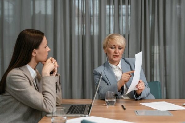 two women discussing Key Changes to ILR in office 