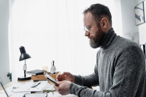 man Calculating Salary Thresholds Under the UK Immigration Salary List