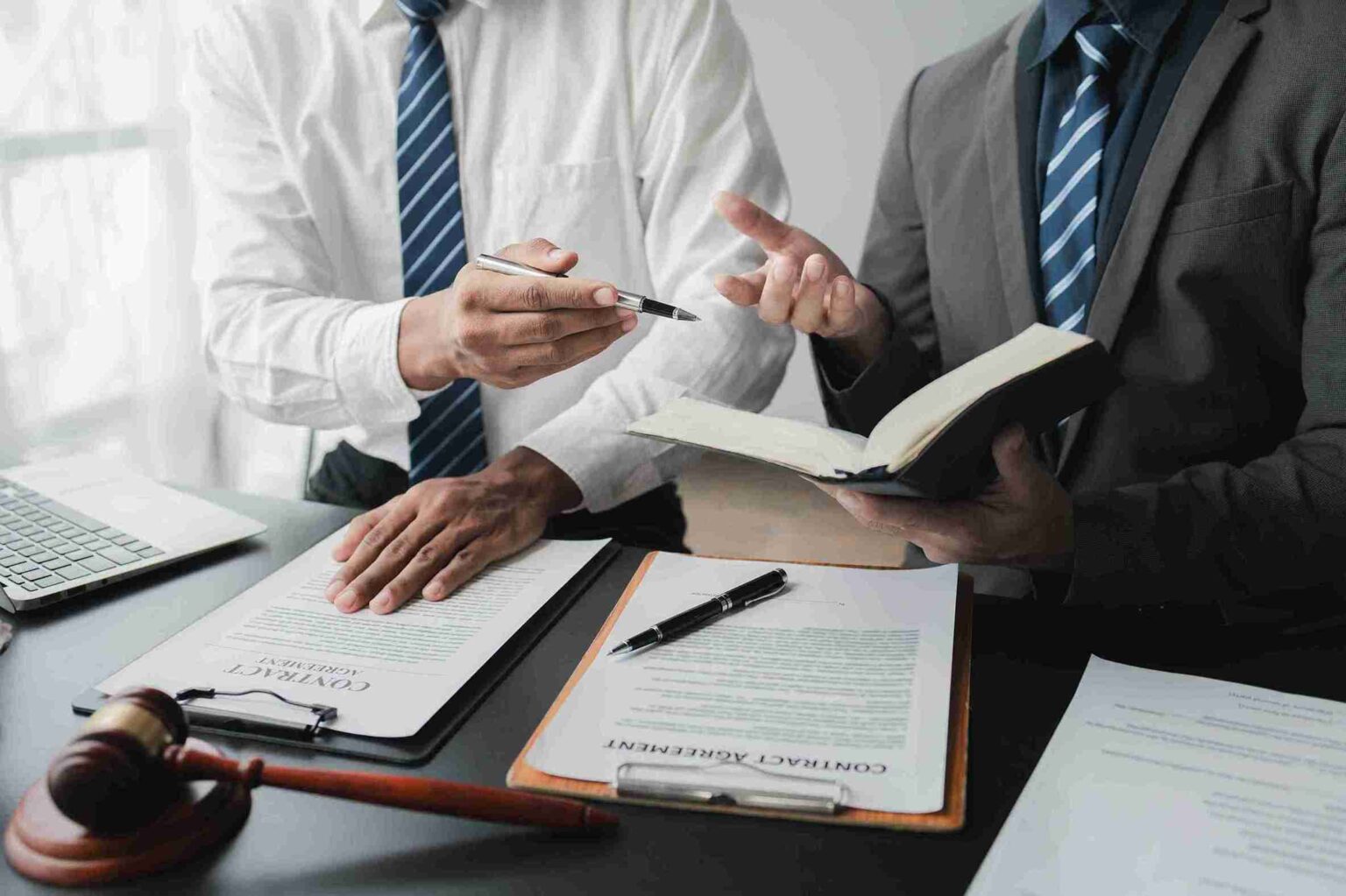 Commercial Litigation A Comprehensive Guide to Key Processes, Legal Implications, and Strategies (Business man sitting with his lawyer discussing the commercial disputes and litigation steps)