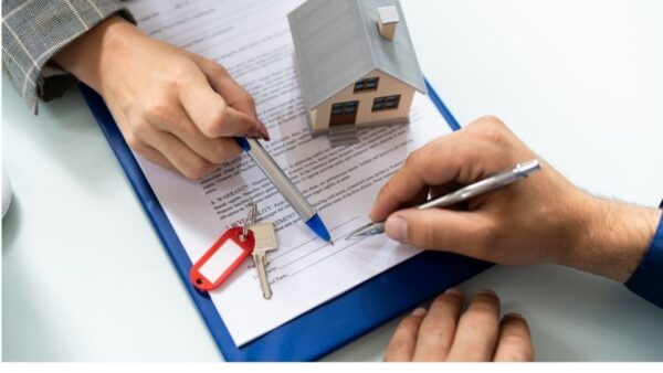 (In the image it can be seen that a man is being guided for a property tile deed by a solicitor) 