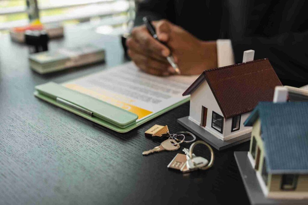 In the image it can be seen a paper is there having title deed written along with a property symbol. What Do Property Title Deeds UK Look Like