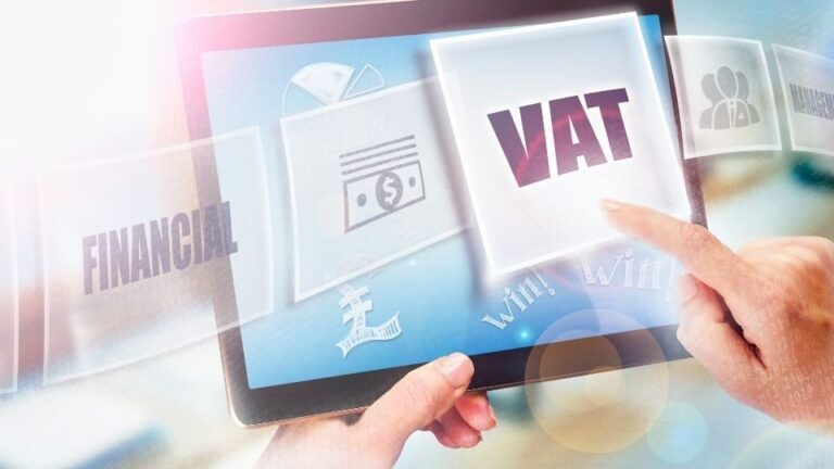 Blog (In the image a businessman can be seen paying VAT in pounds)