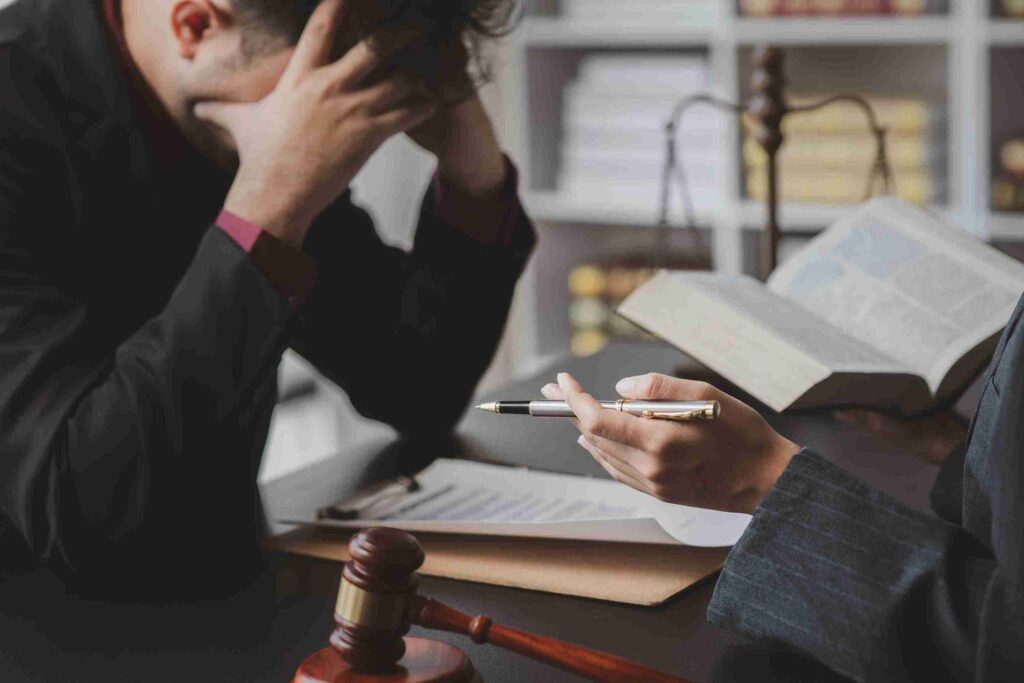 In the image it can be seen solicitors discussing defamation case