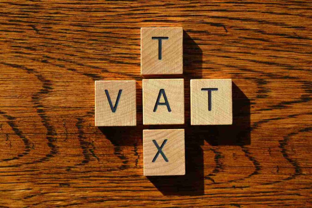 VAT tax is written on wooden blocks on the table.