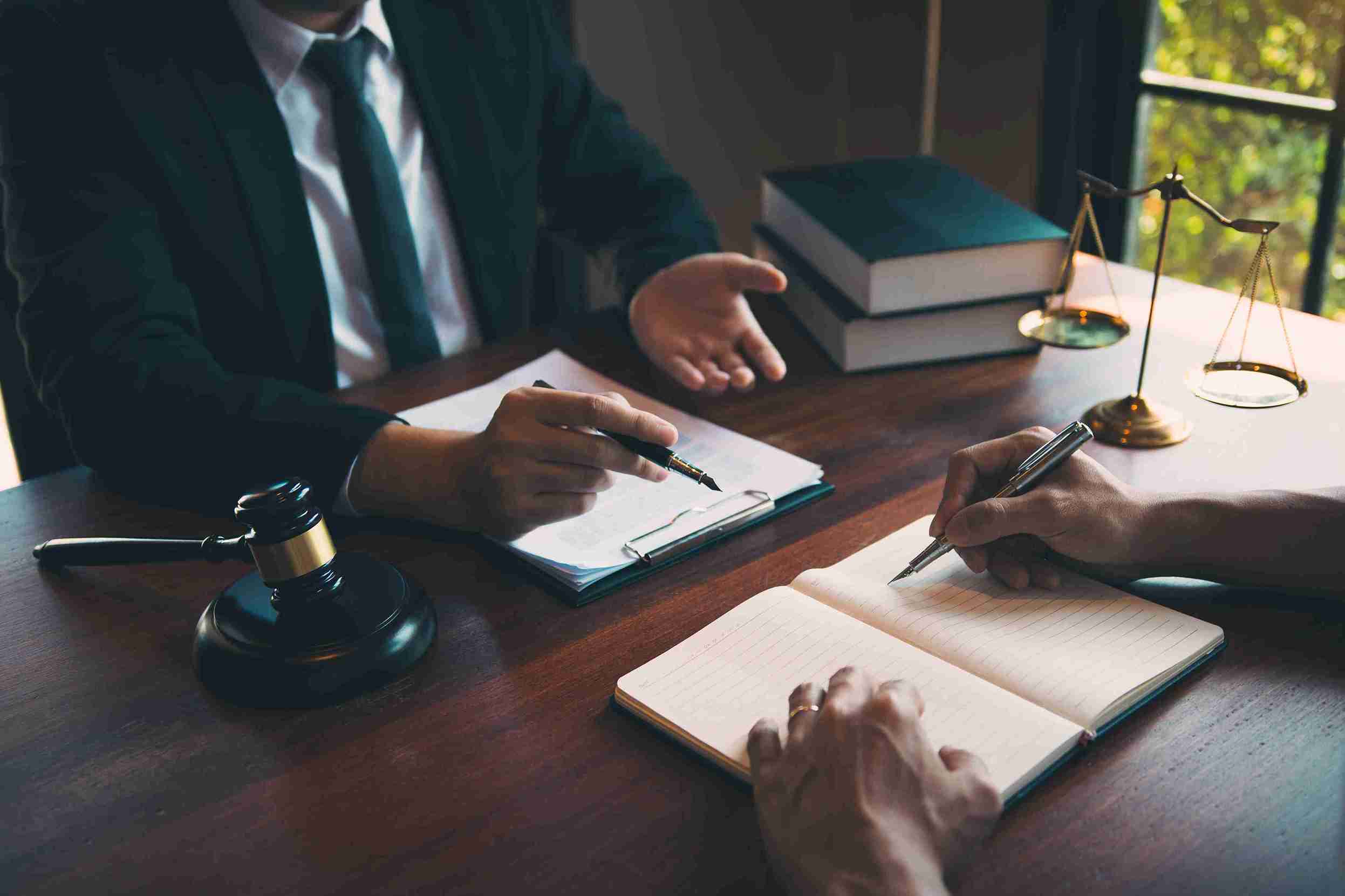 This image is showing a a civil litigator is advising a client before the court hearing