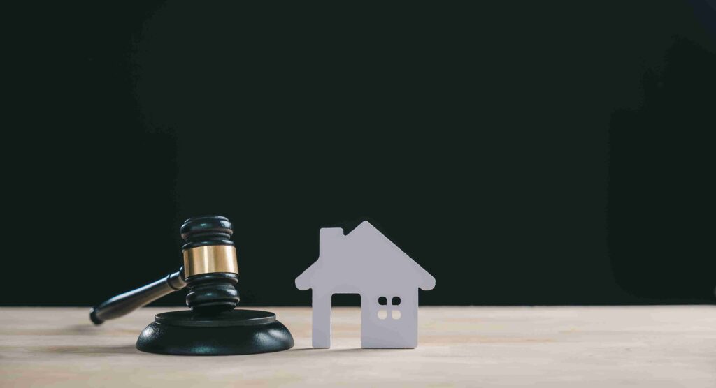 In the image a solicitor can be seen working on a local property dispute case
