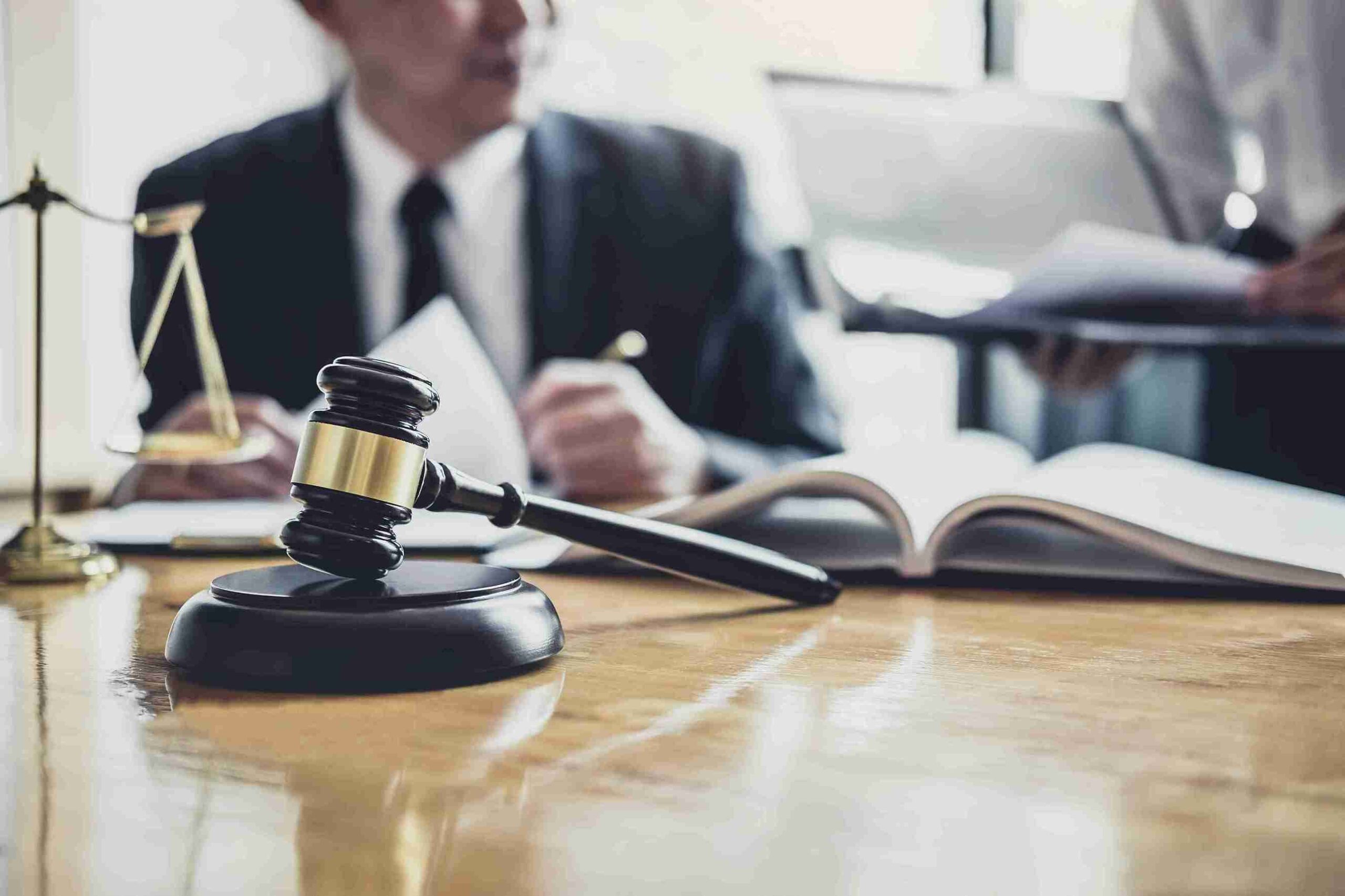 In the image a civil litigation solicitor can be seen providing a client with advice