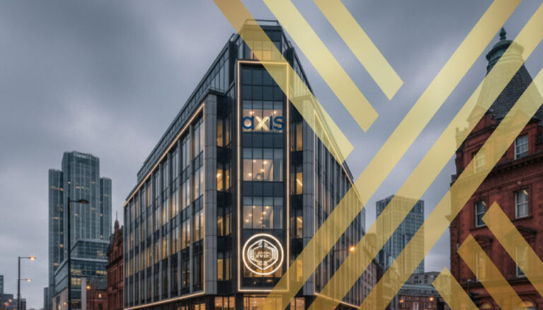 AXIS Solicitors Ranked Among Best Family Law Experts in Manchester A sleek, modern corporate building at a busy intersection in Manchester at dusk, featuring the "AXIS Solicitors" logo prominently displayed on its facade and a glowing sign on the street level.
