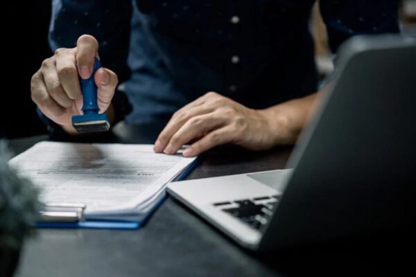 Country-Specific Visa Changes You Shouldn’t Miss solicitors checking documents and stamps them for next step