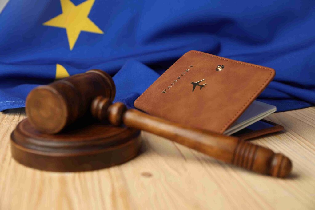 Brown passport with airplane icon beside gavel and EU flag, representing Schengen visa legal support.
