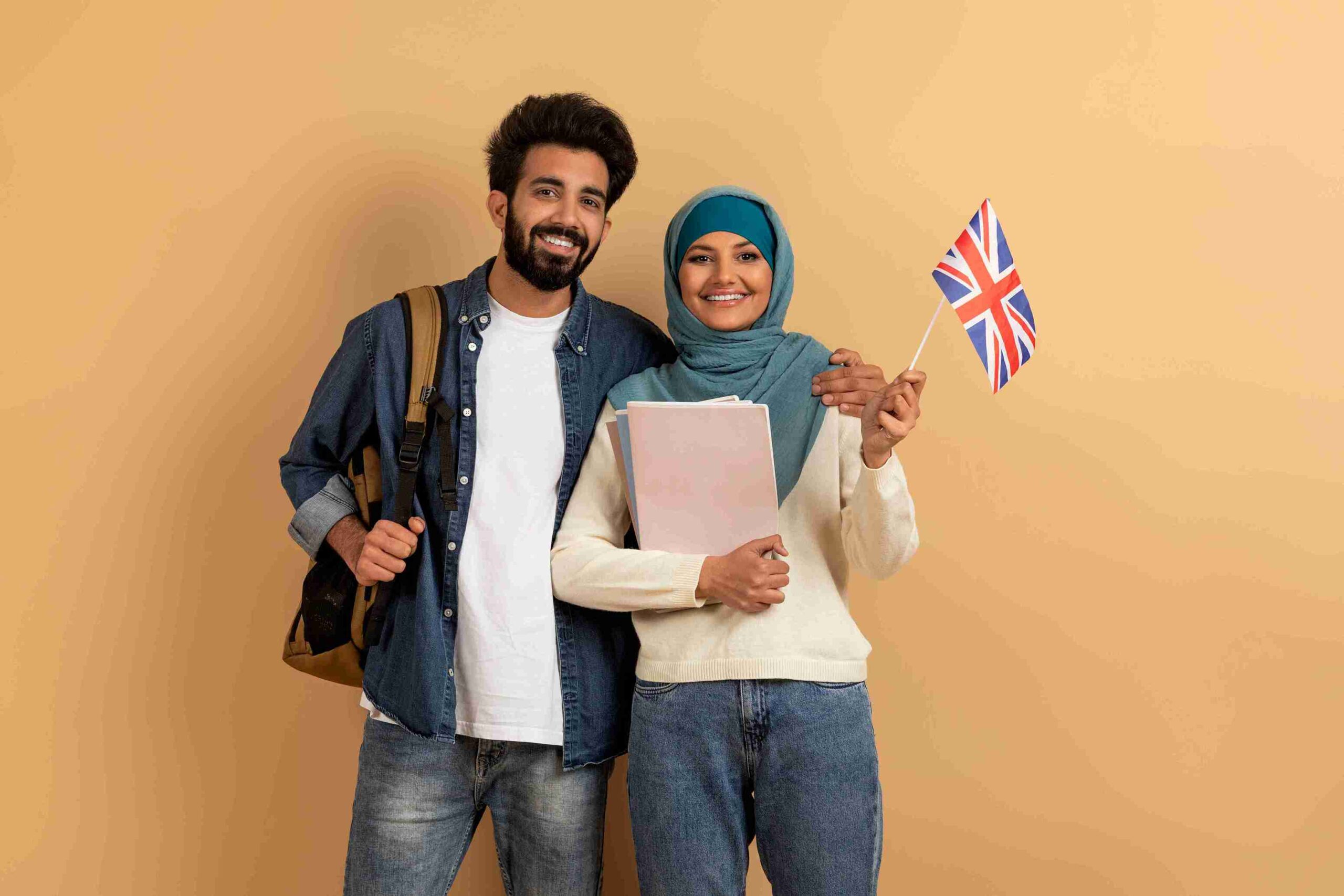 Smiling couple with British flag, representing spouse visa extension for foreign nationals to remain in the UK with a British or settled partner.