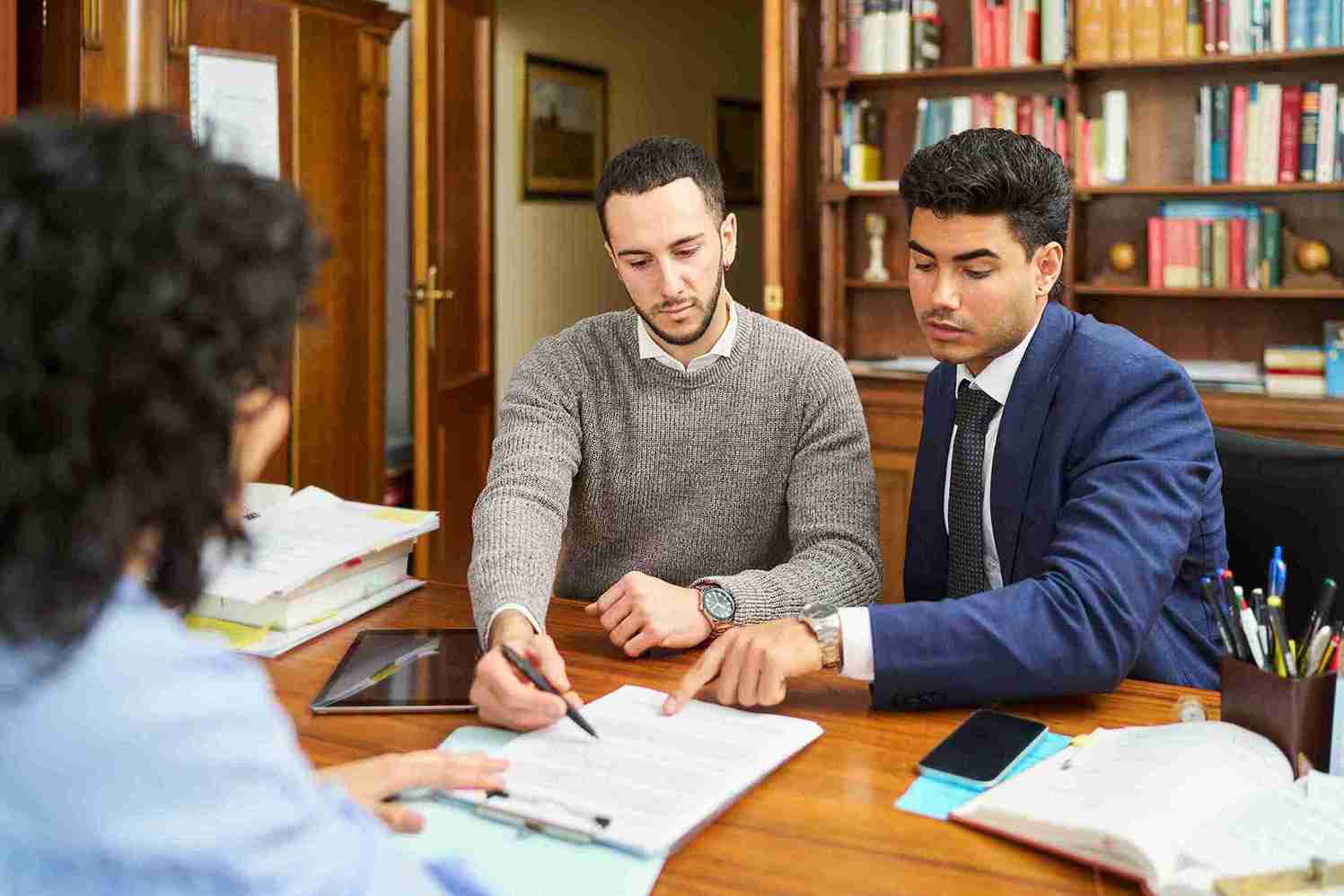 Financial advisors showing contract