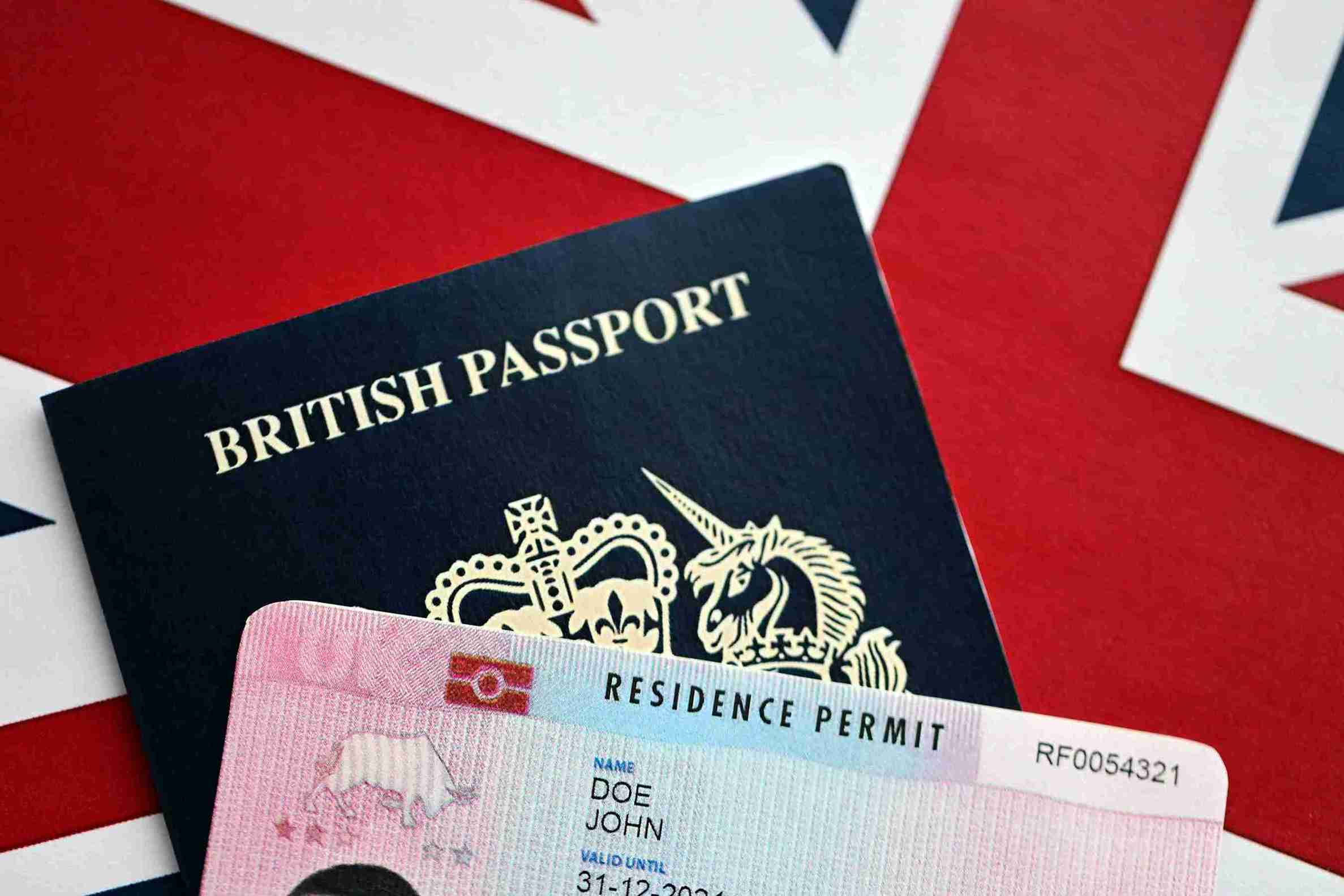 A British passport displayed alongside another British passport, showcasing their distinct covers and official emblems.