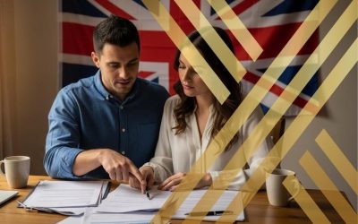 A couple reviewing UK spouse visa documents together with a UK flag in the background
