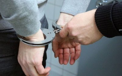 (In the image a corporate offender can be seen being detained) What Are Corporate Disputes Examples and Types?