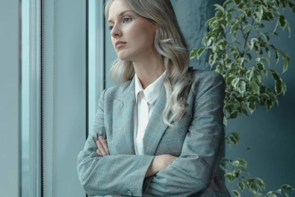 domestic-violence-axis A photo of a caring domestic violence family law solicitor that looks out of the window thinking about a clients case in Birmingham.